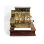 A Victorian brass cash register, damage to glass, piece in drawer, missing side till roll panel