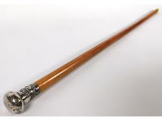 A Malacca cane with Chinese dragon topped white metal handle, 36in long