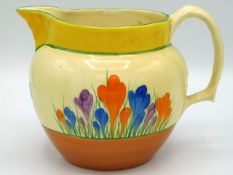 A Clarice Cliff Bizarre crocus design jug, 7.875in wide x 5.75in high, hairline to rim near handle