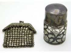 A sterling silver openwork salts bottle twinned with a mesh purse