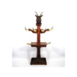 An unusual Victorian hall stand with carved satanic style ram's head & six horns for hangers, remnan