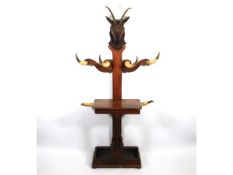 An unusual Victorian hall stand with carved satanic style ram's head & six horns for hangers, remnan