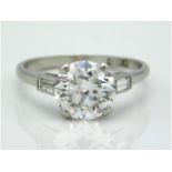 A platinum diamond ring with centre bright, lively centre diamond of approx. 2.36ct & two baguette c