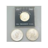An 1888 silver US dollar with lustre twinned with a 1924 silver dollar & a J. F. Kennedy 35th Presid