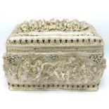 A substantial Burmese style silver casket with heavy relief figurative decor throughout, 15.5in wide