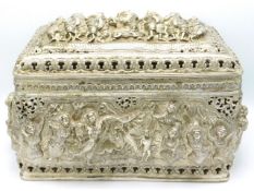 A substantial Burmese style silver casket with heavy relief figurative decor throughout, 15.5in wide