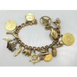 A 9ct gold & yellow metal charm bracelet including three gold coins that electronically test as 18ct
