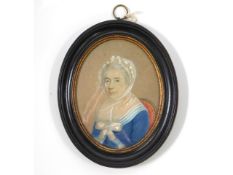 A 19thC. miniature watercolour portrait of lady in bonnet & blue dress, sat in chair. Image size 98m