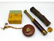 An early 20thC. small brass telescope with case twinned with Rabone measuring tape with original box