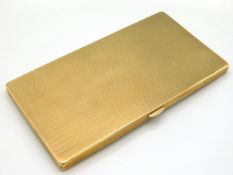 A 9ct gold cigarette case with machined decor, made by B. H. Britton, assayed in Birmingham 1921, 15