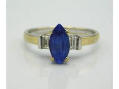 An 18ct gold marquise cut tanzanite & diamond ring, some light abrasions to centre stone, 3.2g, size