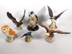 A Beswick golden eagle, 2062, a Beswick bald eagle, 1018, a Beswick owl 1046, twinned with a Spode o