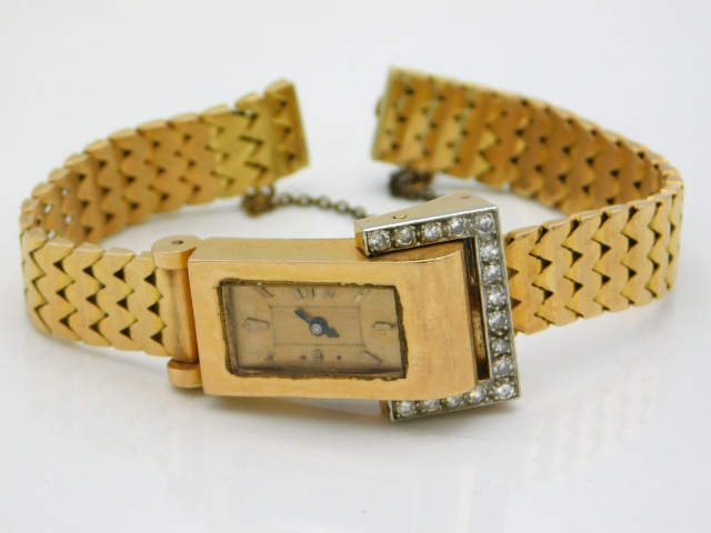 An 18ct gold ladies watch, strap clasp a/f & winder missing, set with approx. 0.33ct of diamond, 33g