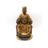 A Chinese gilt lacquered wood figure of an immortal, 9.5in tall