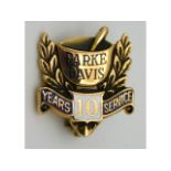 A 10ct gold enamelled Parke Davis ten years service brooch, 2.2g