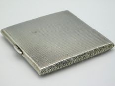 A 1924 Birmingham silver cigarette case with machined decor by Deakin & Francis, 118.3g