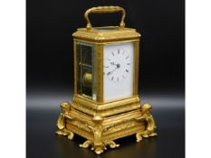 A good 19thC. French repeating carriage clock by Aubert & Co. with engraved decor & ornate stand wit