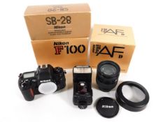 A Nikon F100 35mm film camera with lenses, accessories & original boxes, items present as unused as