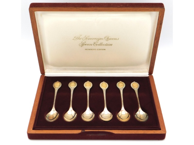 A cased set of Sheffield silver "Sovereign Queens Spoon Collection" with 24ct gold "embellishing", 1