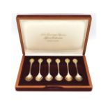 A cased set of Sheffield silver "Sovereign Queens Spoon Collection" with 24ct gold "embellishing", 1