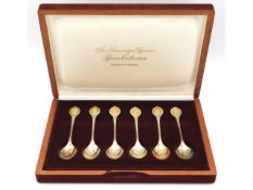 A cased set of Sheffield silver "Sovereign Queens Spoon Collection" with 24ct gold "embellishing", 1