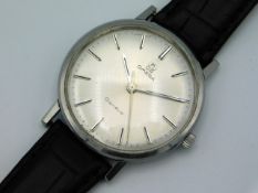 A gent's Omega Geneve wrist watch in stainless steel case with later leather strap, case 34mm, curre