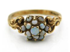 A 9ct gold opal set ring with carved shoulder decor, 2.1g, size S
