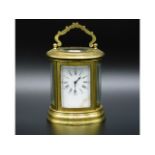 A 19thC. French oval miniature carriage clock, stamped to rear Paris 96268, plain finish, damage to