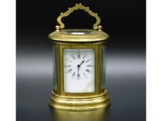 A 19thC. French oval miniature carriage clock, stamped to rear Paris 96268, plain finish, damage to