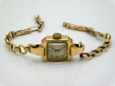 A Giroxa 18ct gold cased ladies watch with a 9ct gold strap, 14.2g