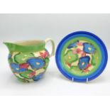 A Clarice Cliff Bizzare blue chintz design jug & plate, jug 6.75in wide x 5in high, jug has small, v