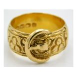 An Edwardian, 1903, 18ct gold buckle ring, size R, 10.3g
