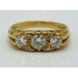 An antique 18ct gold ring set with three main diamonds & four small, approx. 0.55ct total, 3.9g Size