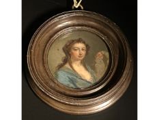 In the style of George Engleheart (1750-1829), a miniature watercolour portrait of a lady in dark bl