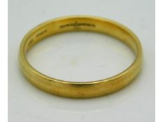 An 18ct gold band by Brown & Newirth, London, size L 2g