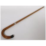 A traditional walking cane with 1923 Kendall & Sons London silver tip & collar, 36in long