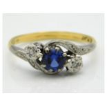 An 18ct gold ring with platinum mounted sapphire & illusion set small diamonds, 2.5g, size P
