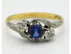 An 18ct gold ring with platinum mounted sapphire & illusion set small diamonds, 2.5g, size P