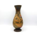 An early 20thC. Irish folk art wooden vase with Celtic bird decor, 12in tall