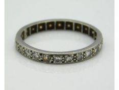 A platinum ring eternity set with approx. 0.8ct diamonds, electronically tests as platinum, 1.8g, si