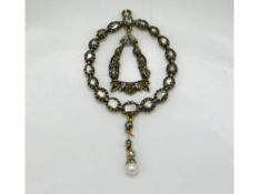 A 19thC. gold & silver pendant set with diamonds & pearl, fault to top link & detachment as shown, 6
