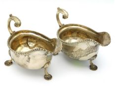 A pair of Edwardian 1909 London silver sauce boats by C. S. Hams Ltd. 510g
