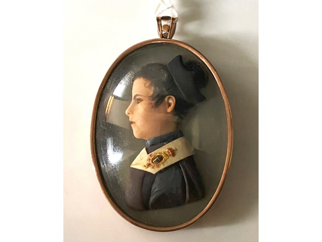 An Italian school, early 19thC. coloured wax miniature portrait plaque of a novitiate monk, of Royal