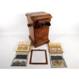 A walnut, table top stereoscope viewer with approx. 164 cards including topographical, portraits, an