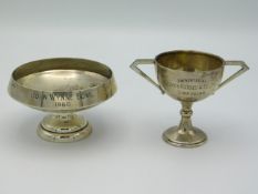 Two white metal Indian golf tournament trophies - a John Wynne bowl twinned with a trophy "presented