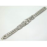 An impressive 1920's white gold bracelet set with approx. 12ct bright, lively diamonds, central ston