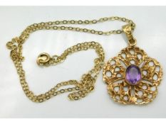 A 9ct gold 18in chain & with 38mm high pendant set with amethyst, 6.5g