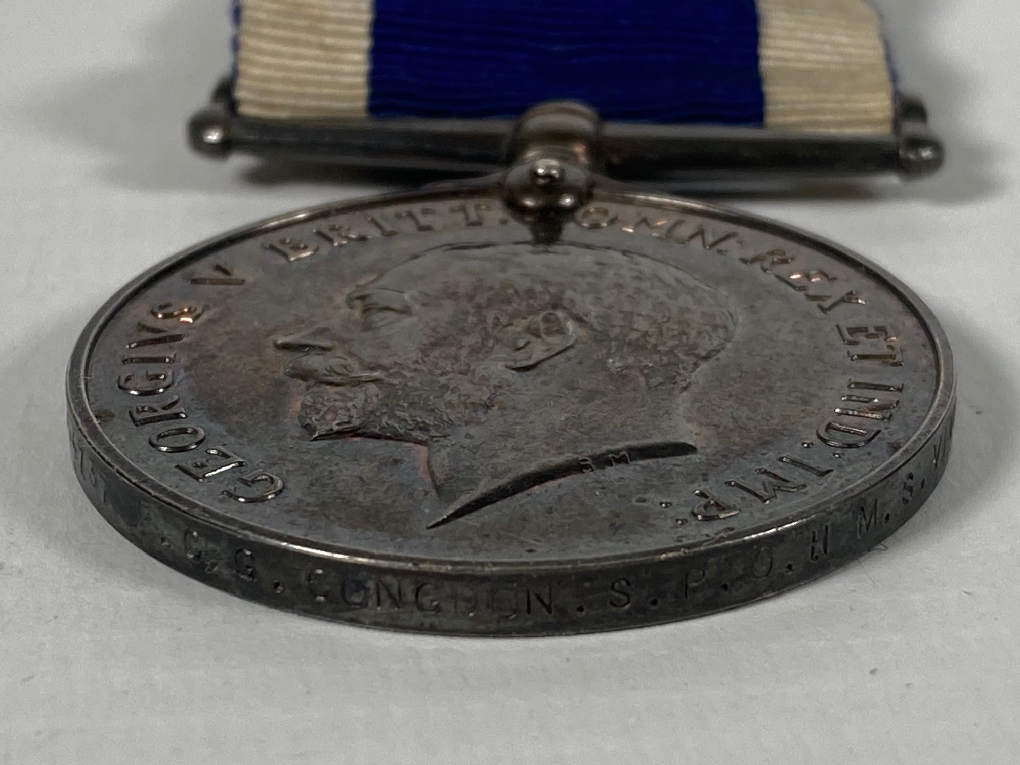 A George V long service & good conduct medal awarded to F.C.G Congdon S.P.O HMS Vivid - Image 4 of 5