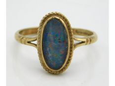 A 9ct gold ring set with black opal doublet, 1.7g, size M