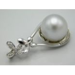 A certificated large South Sea cultured pearl mounted in 18ct gold, set with diamonds, metal weight